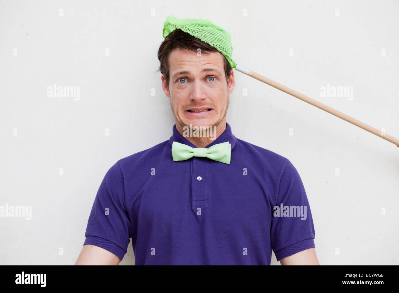 man getting caught by butterfly net Stock Photo