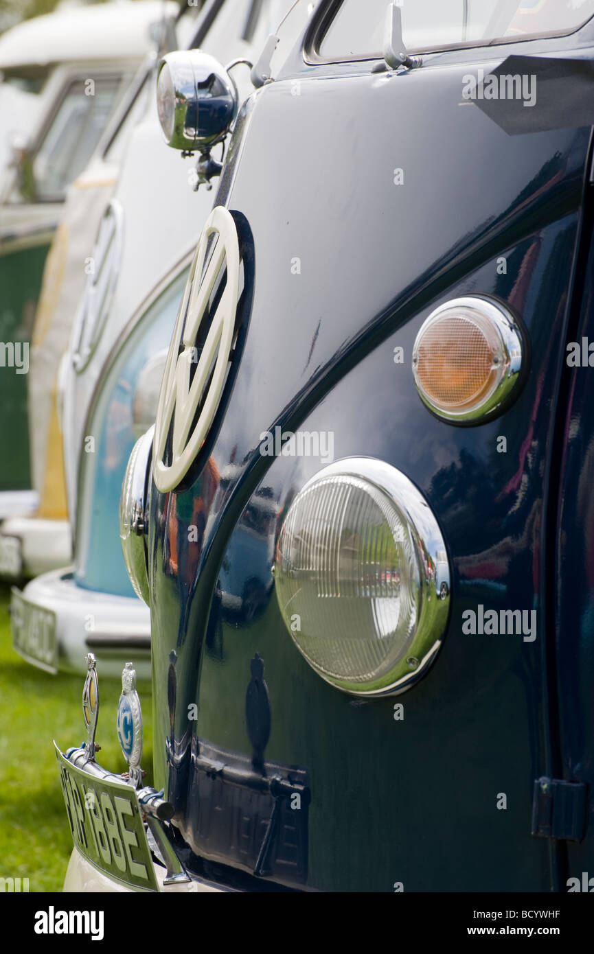 Row of colourful volkswagen camper vans at an enthusiasts rally Stock Photo