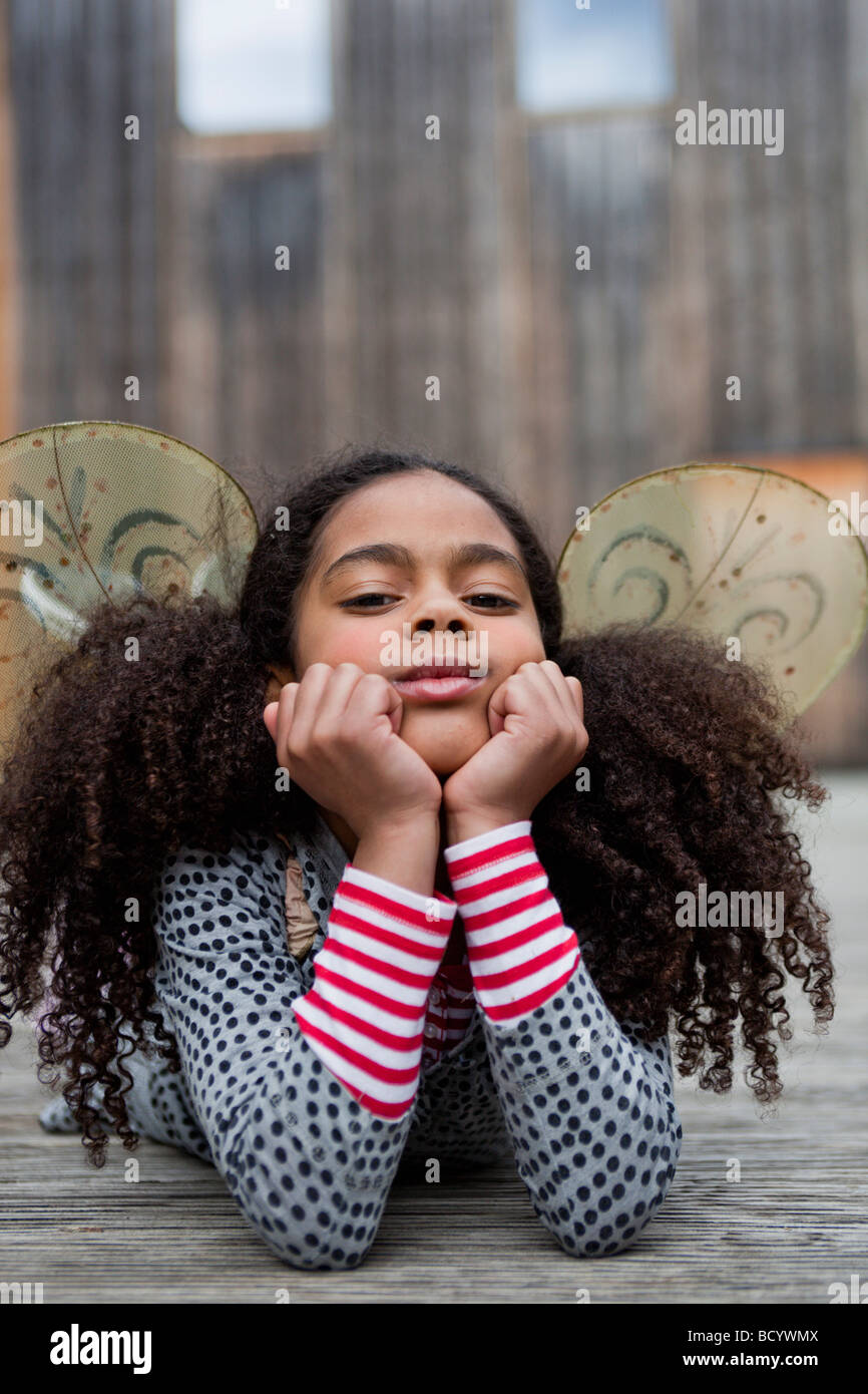 young girl resting her head on her hands Stock Photo - Alamy