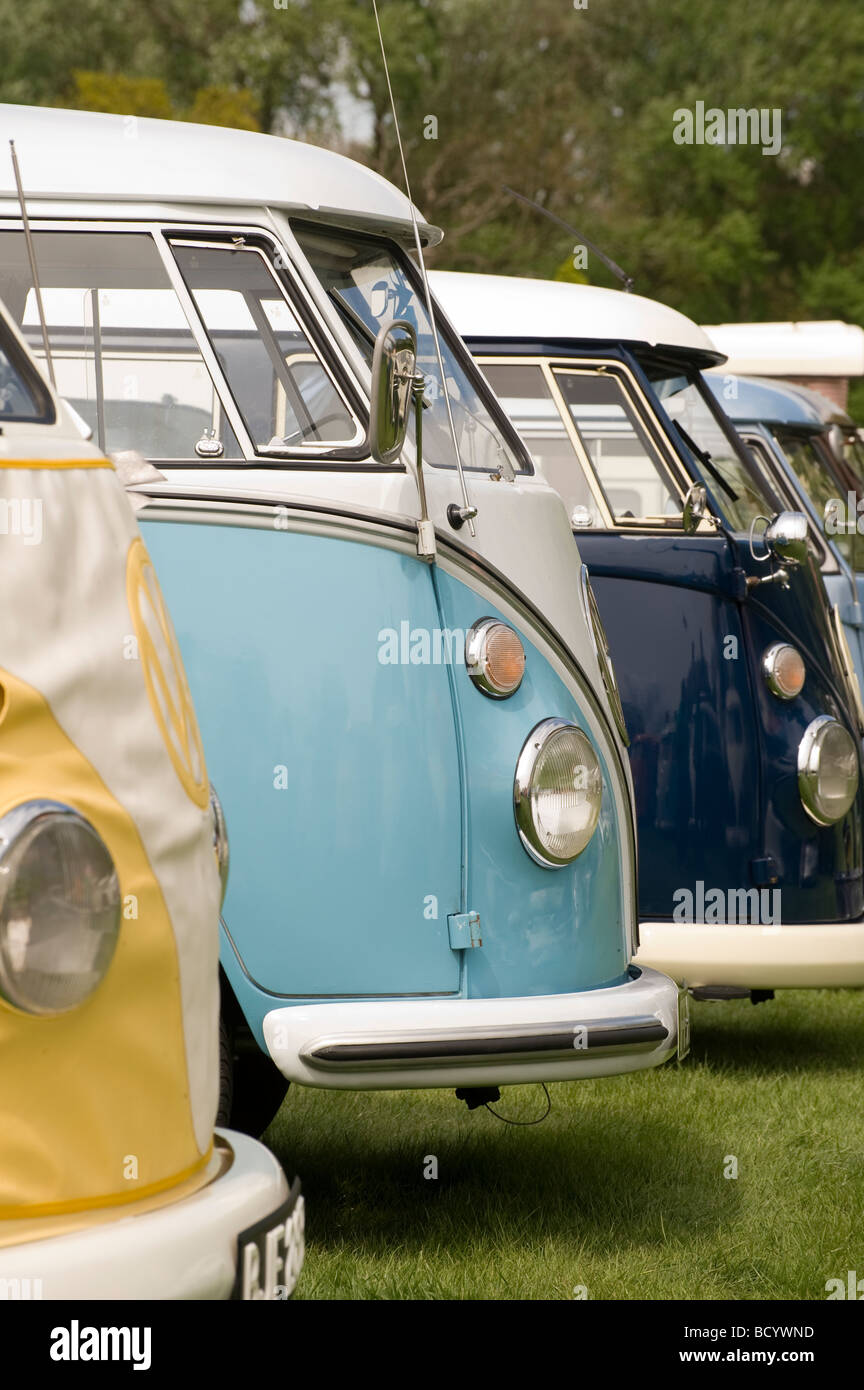 Row of colourful volkswagen camper vans at an enthusiasts rally Stock Photo