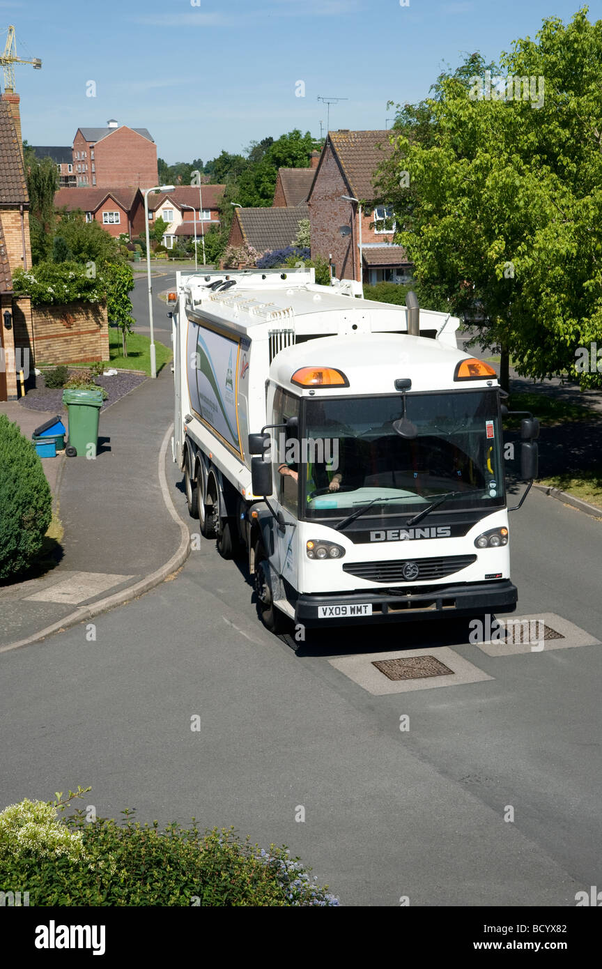 Dennis refuse lorry collecting rubbish and recycling waste on a suburban street in England Stock Photo
