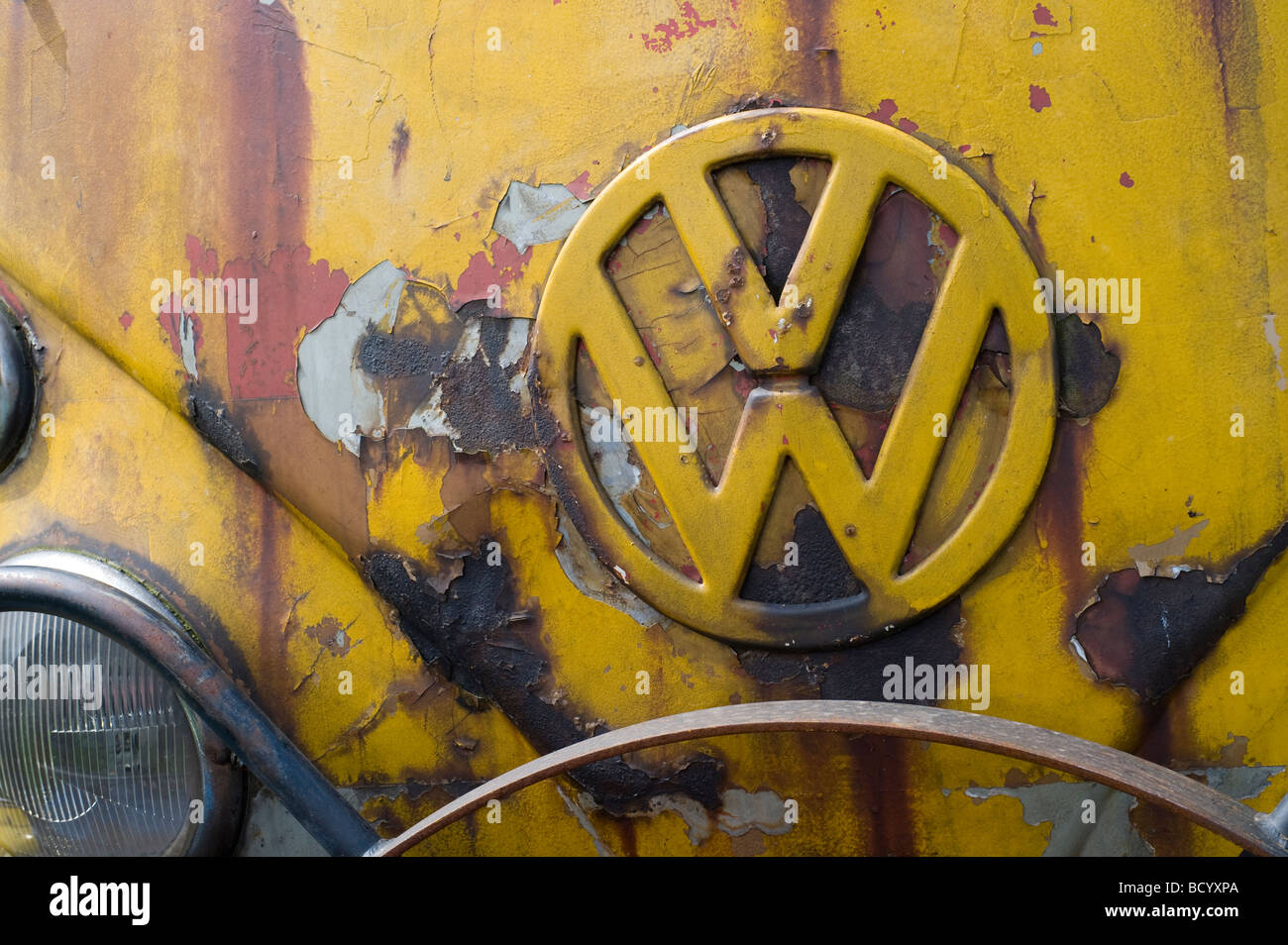 Close up of the badge on the front of an old rusty volkswagen camper van Stock Photo