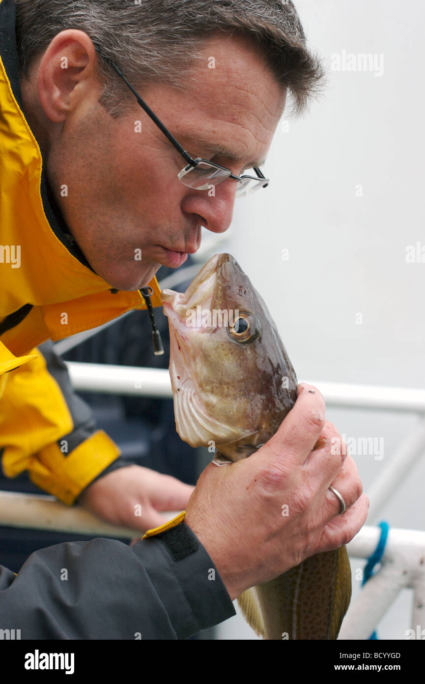 Man kissing his fish hi-res stock photography and images - Alamy
