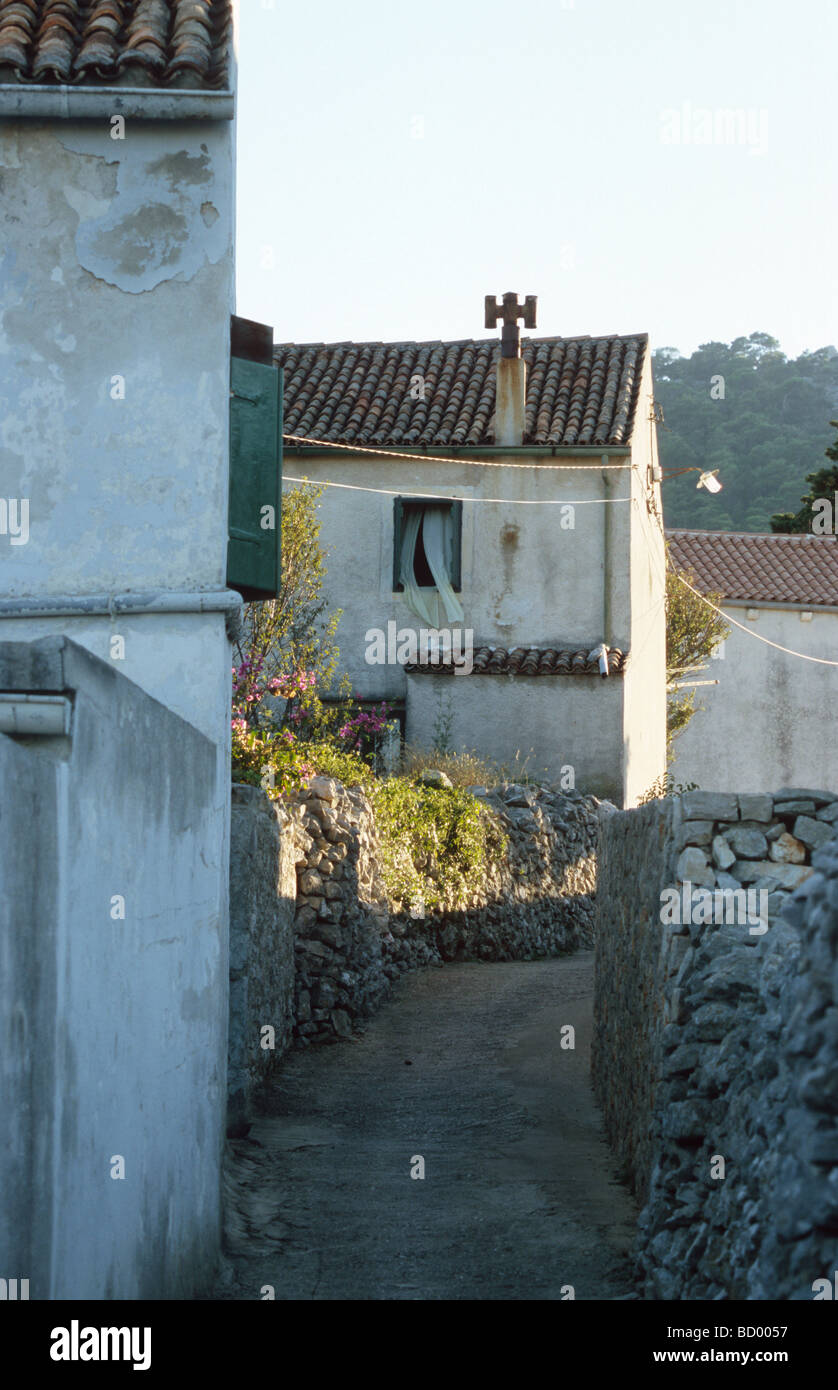 Pathway with old stone houses in Rovenska, Mali Losinj, Croatia, Balkans Stock Photo