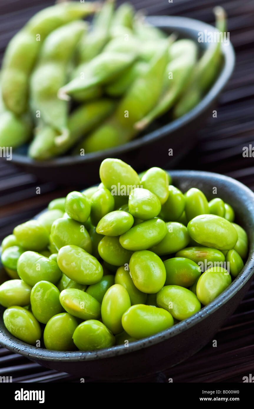 Edamame soy beans shelled and with pods in bowls Stock Photo Alamy