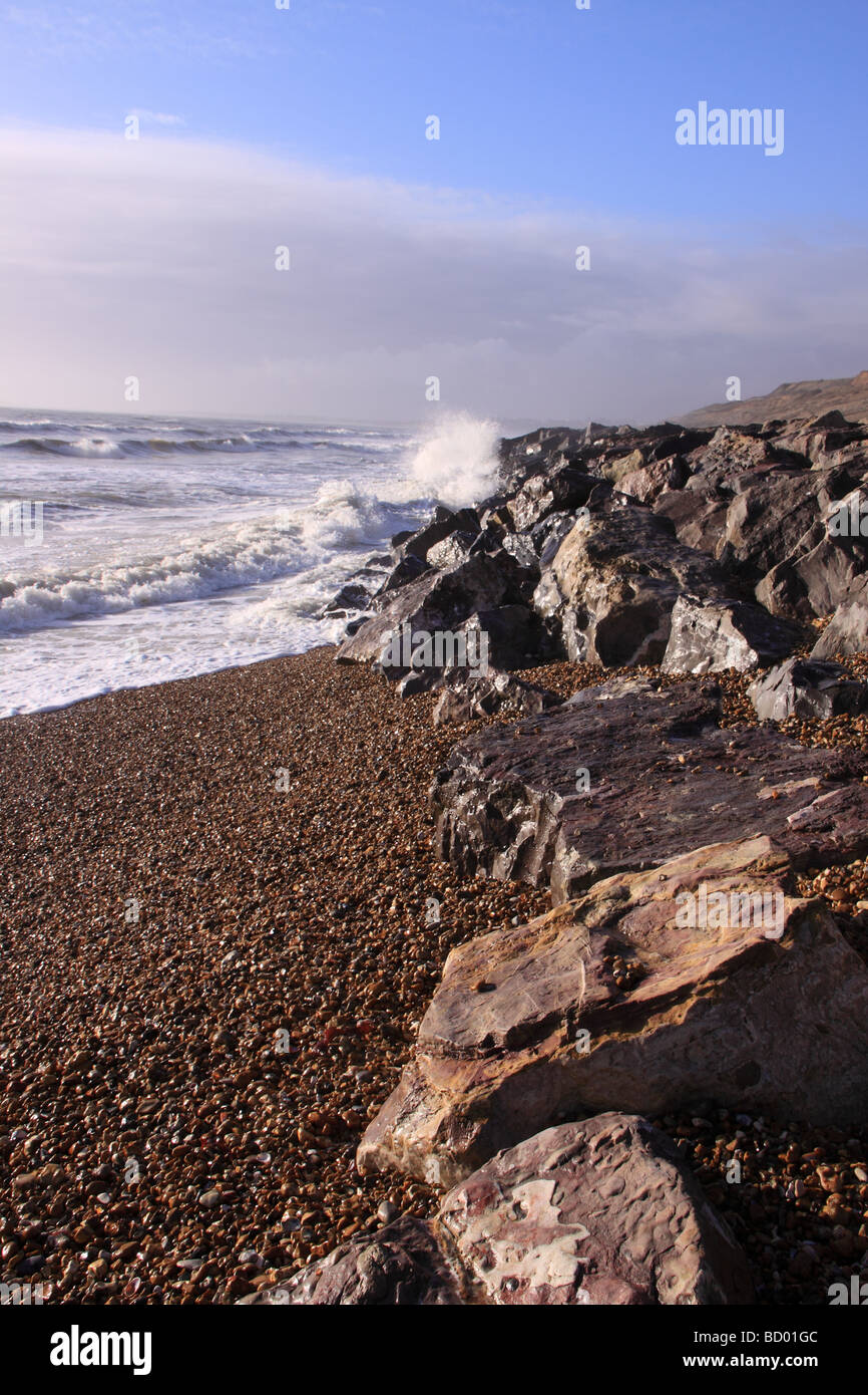 Waves crashing onto rocks at Barton on Sea beach, near New Milton