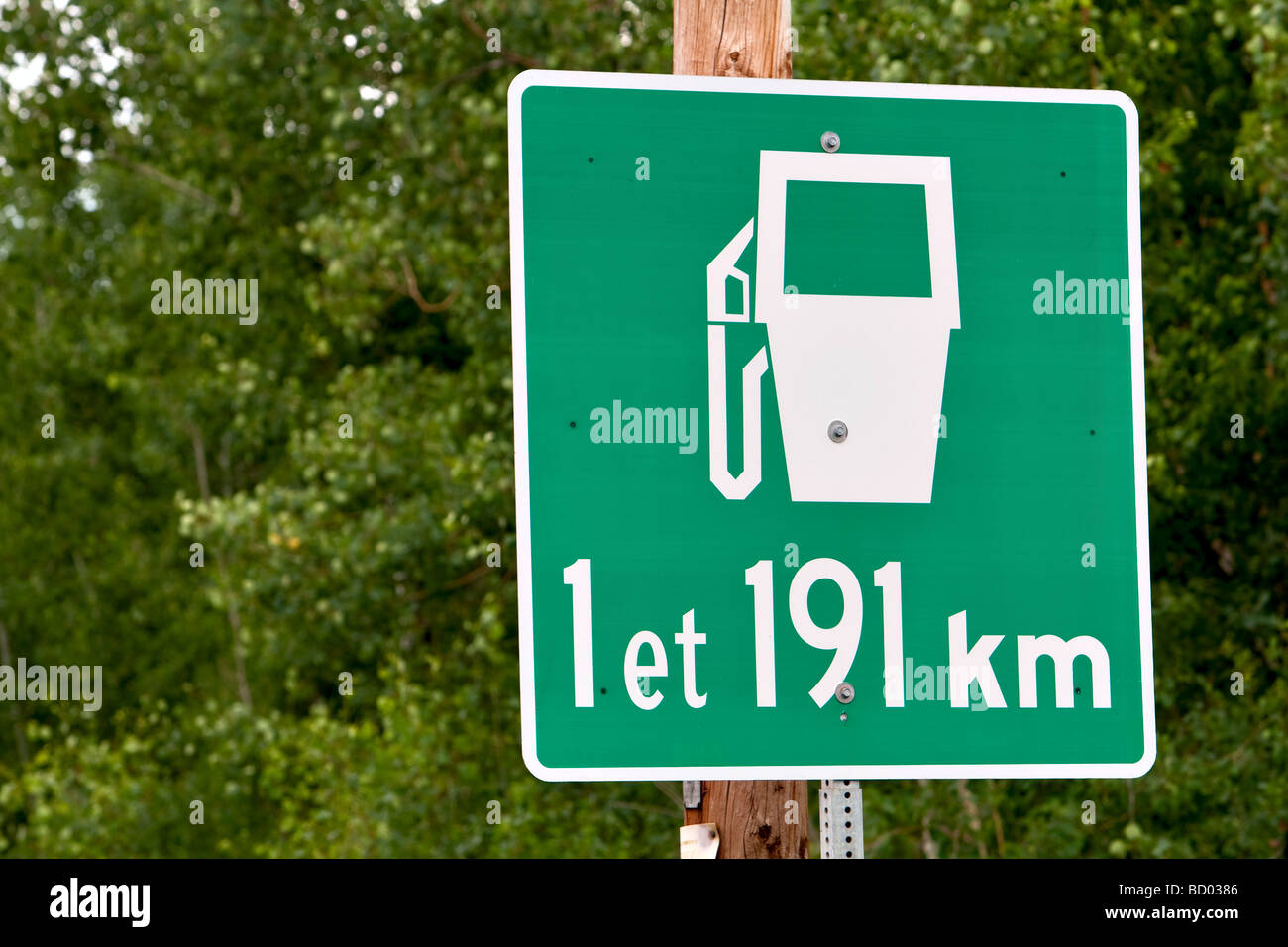 A sign announces gaz station in one and 191kmat the entrance of the the Reserve Faunique Ashuapmushuan Wildlife Reserve, Quebec Stock Photo