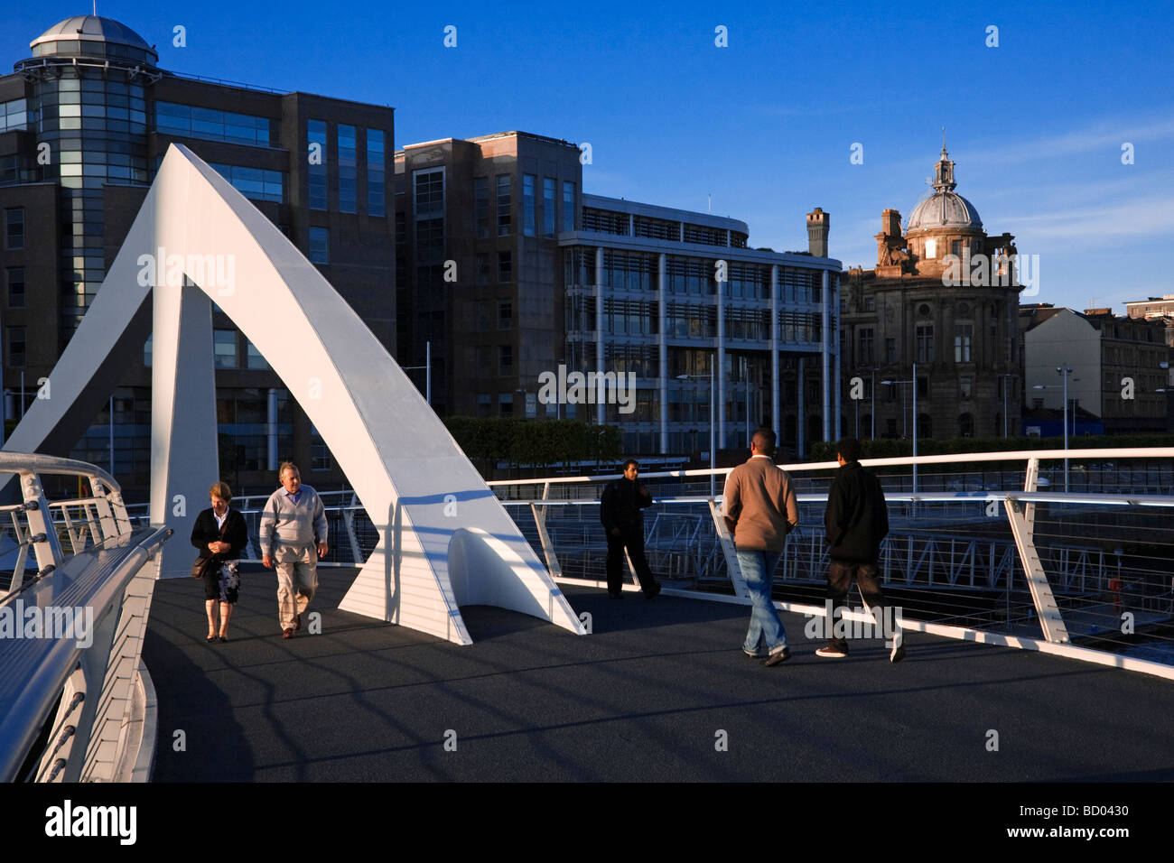 The Tradeston Pedestrian Bridge crossing the river Clyde locally known as the Squiggly bridge Glasgow Scotland  Stock Photo