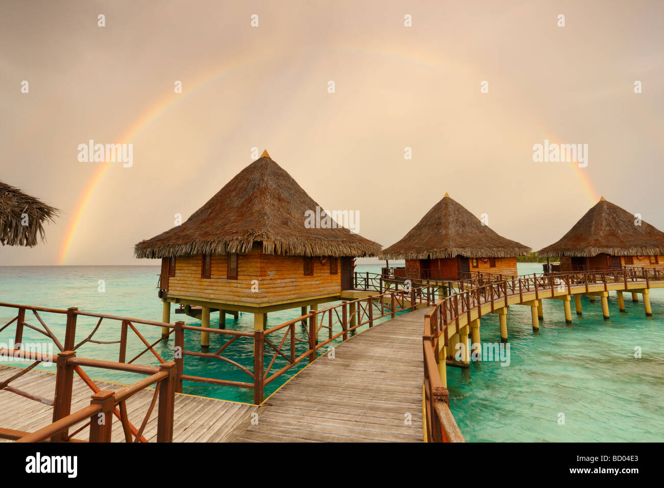 Sunrise and rainbow over Kia Ora Resort, Rangiroa, Tuamotu Archipelago, French Polynesia Stock Photo