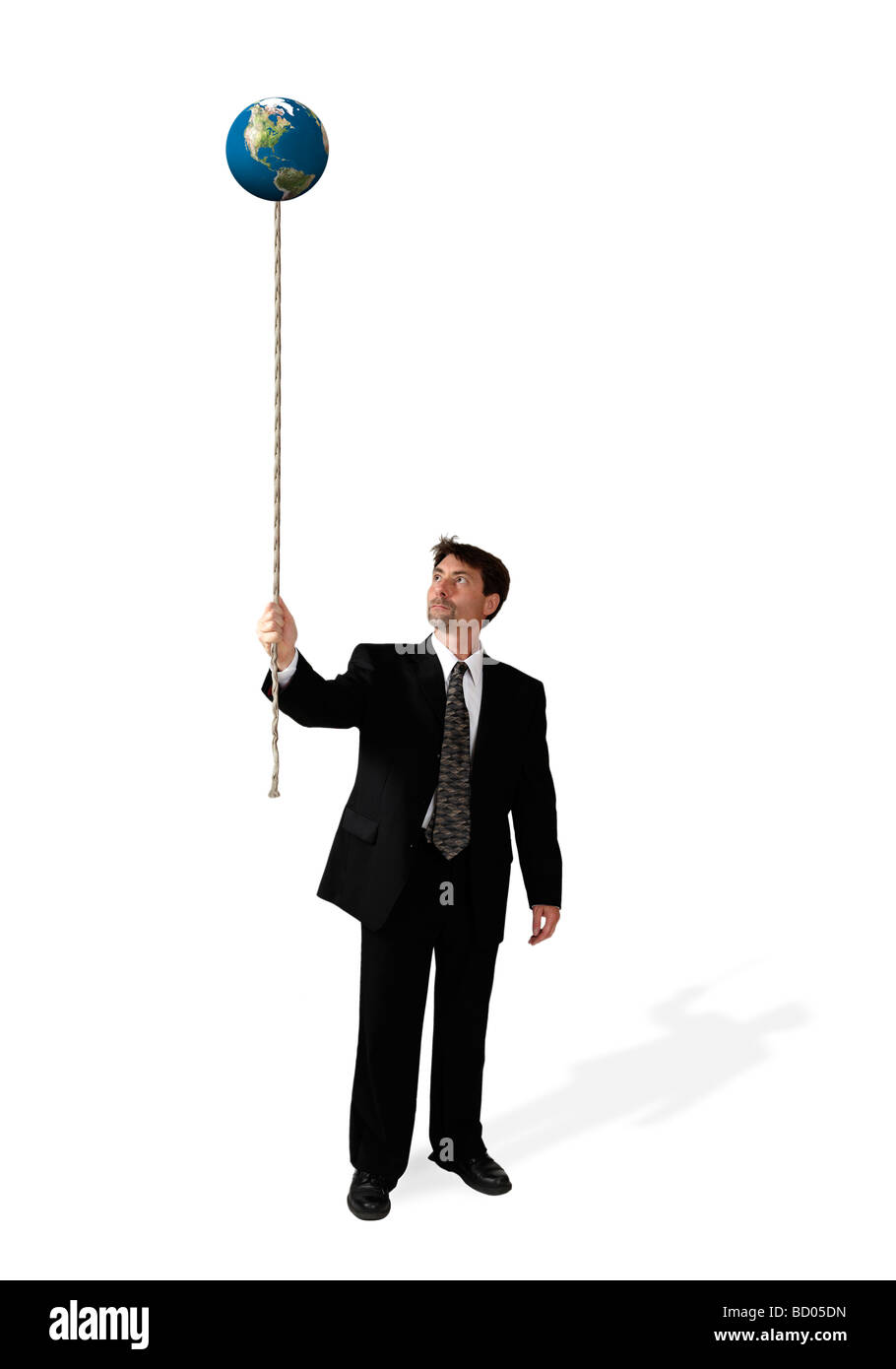 Businessman holding floating planet earth attached to a rope Stock ...