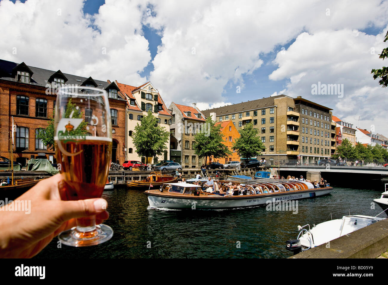 Cheers to the sightseeing boat in Christianshavn canal, Copenhagen, Denmark, Europe Stock Photo