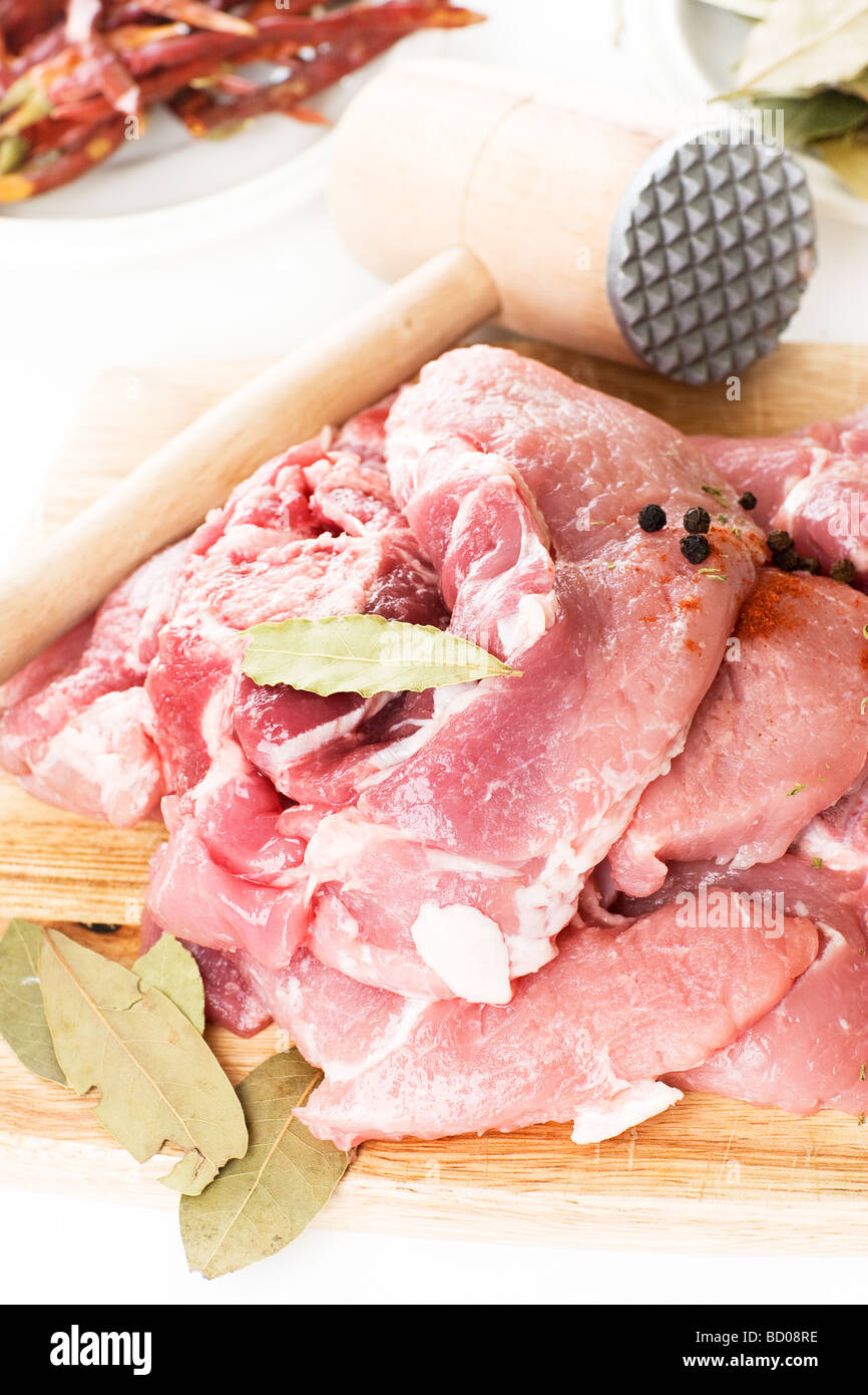 Close up of fresh pork meat on wooden board Stock Photo