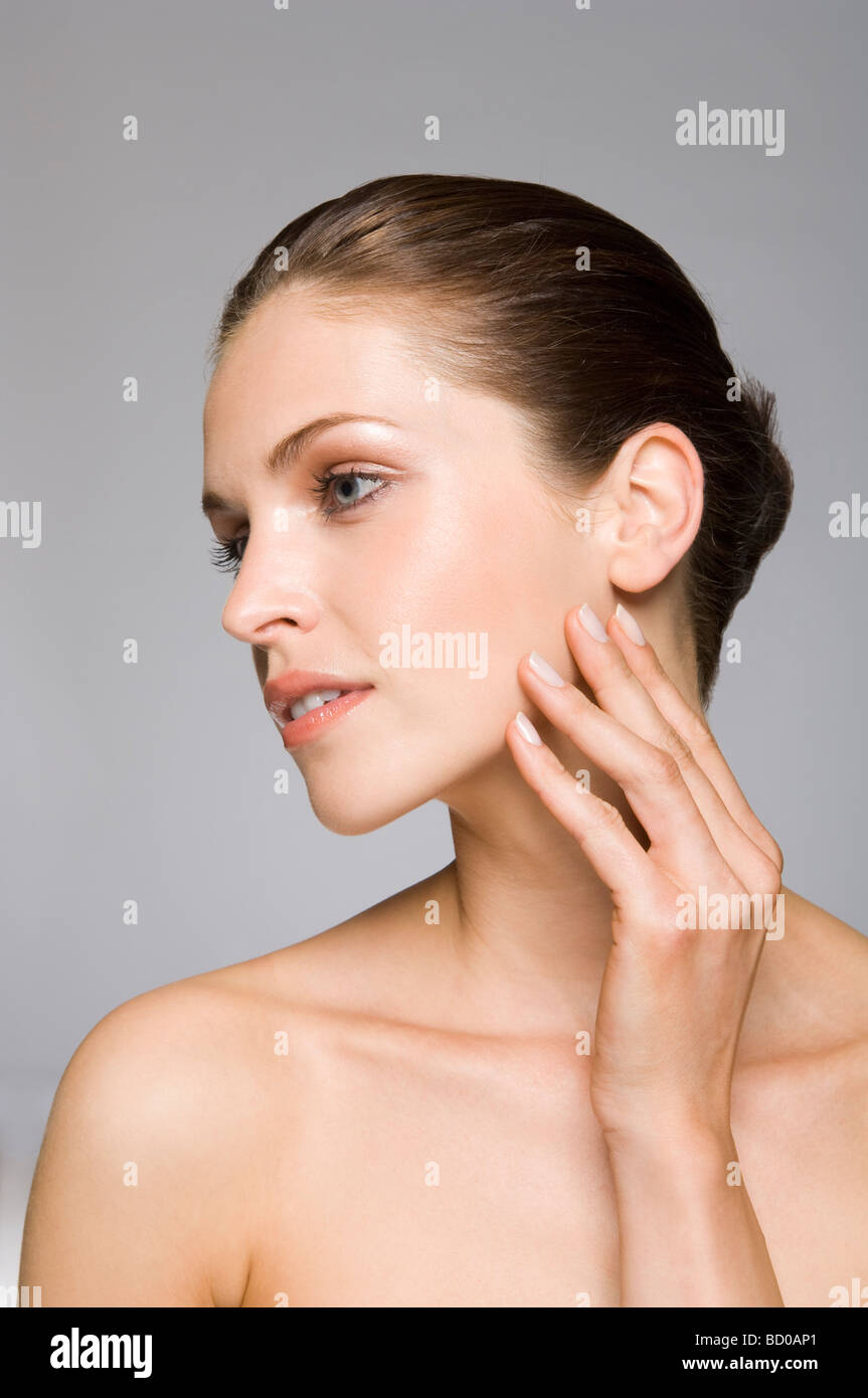 Female beauty model touching skin Stock Photo - Alamy