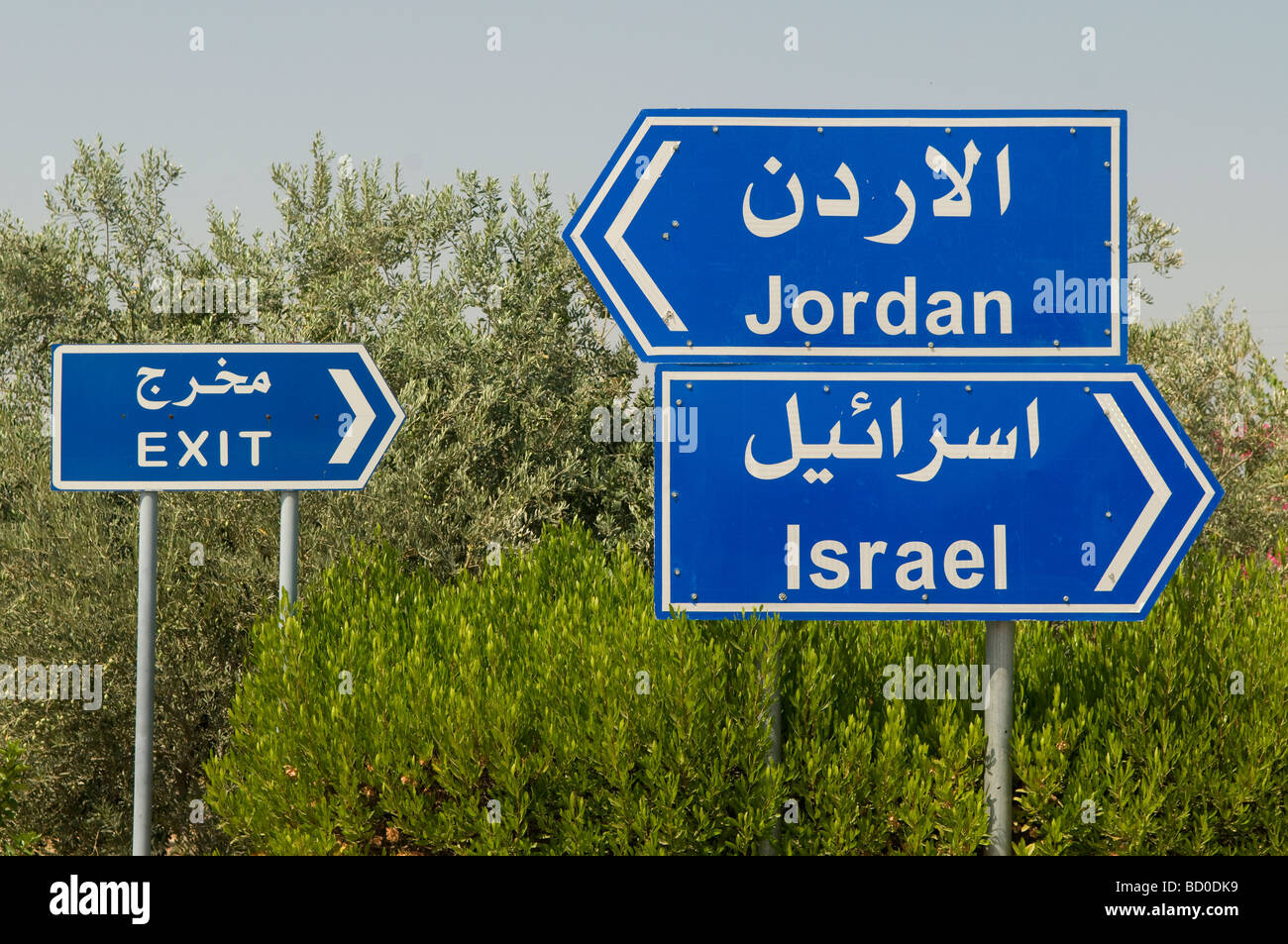 Road signs at the Sheikh Hussein Bridge crossing point between Israel and Jordan at the Jordan Valley Stock Photo