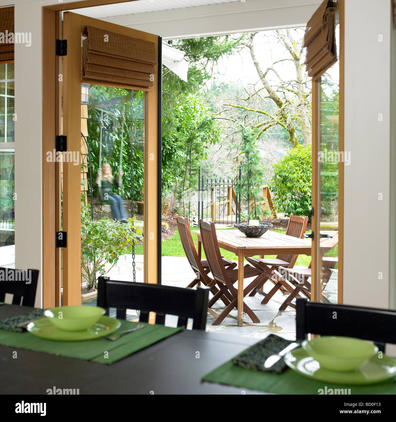 Looking past dining room out to patio garden, Victoria, British