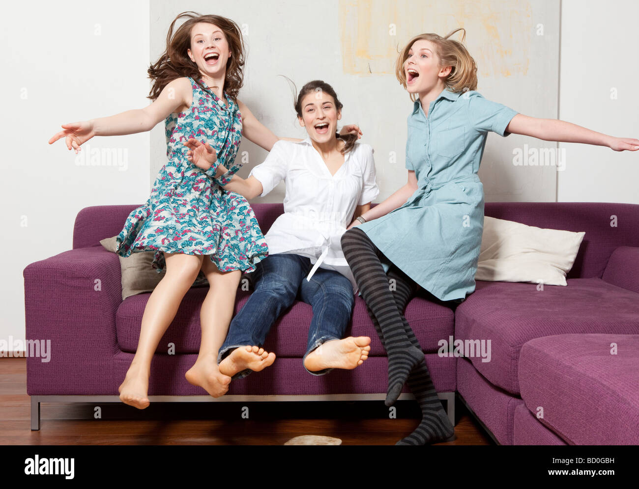 Three women jumping and jubilating Stock Photo