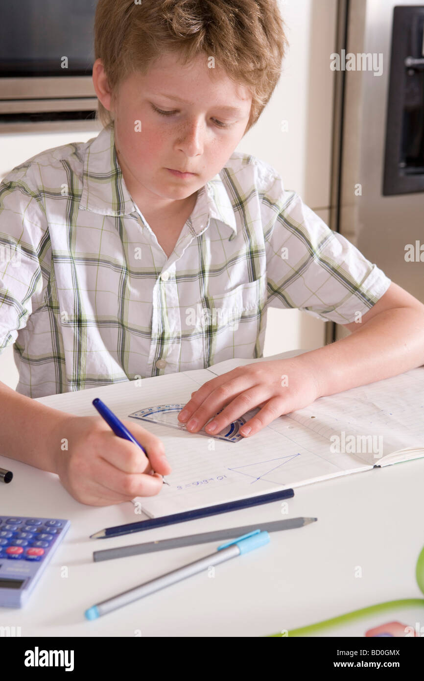 Boy 11, studying at home Stock Photo