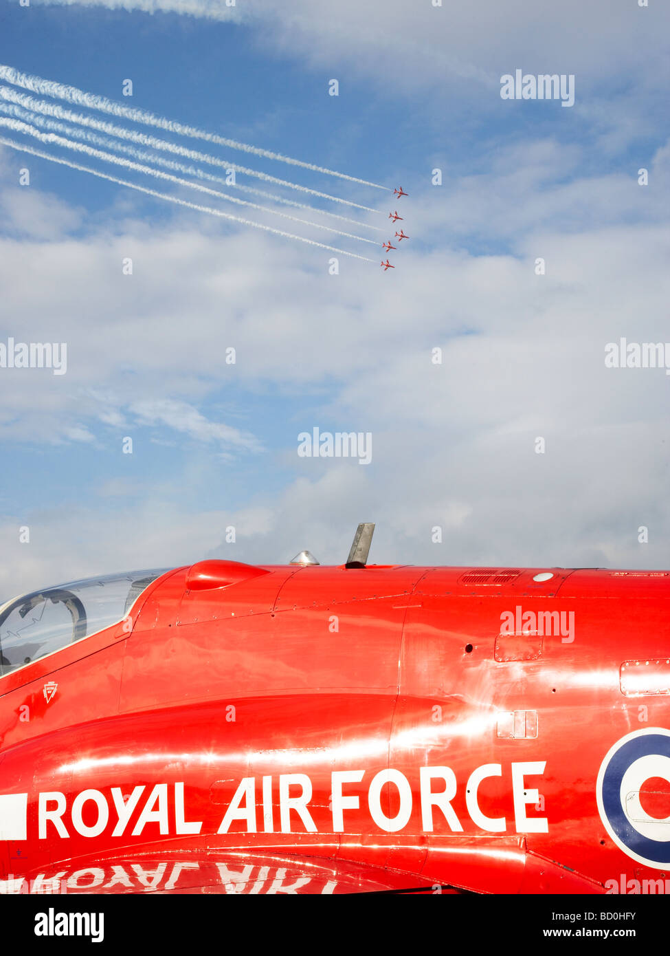 Red Arrows flying in formation, with detail of a landed craft in foreground Stock Photo
