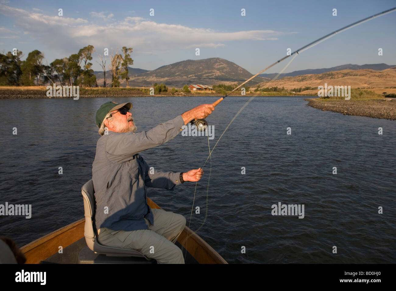 Fisherman casts on the Yellowstone River near to Emigrant. Fly fishing