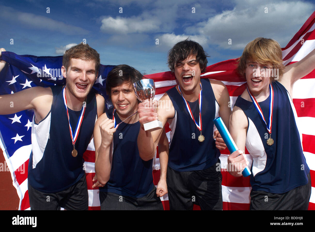 relay team with flag and medal Stock Photo Alamy