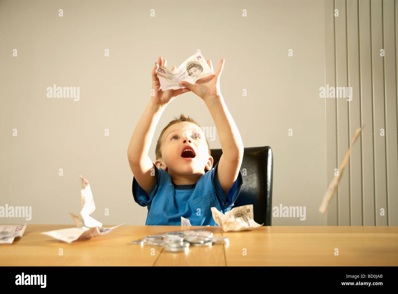 boy catching money Stock Photo Alamy