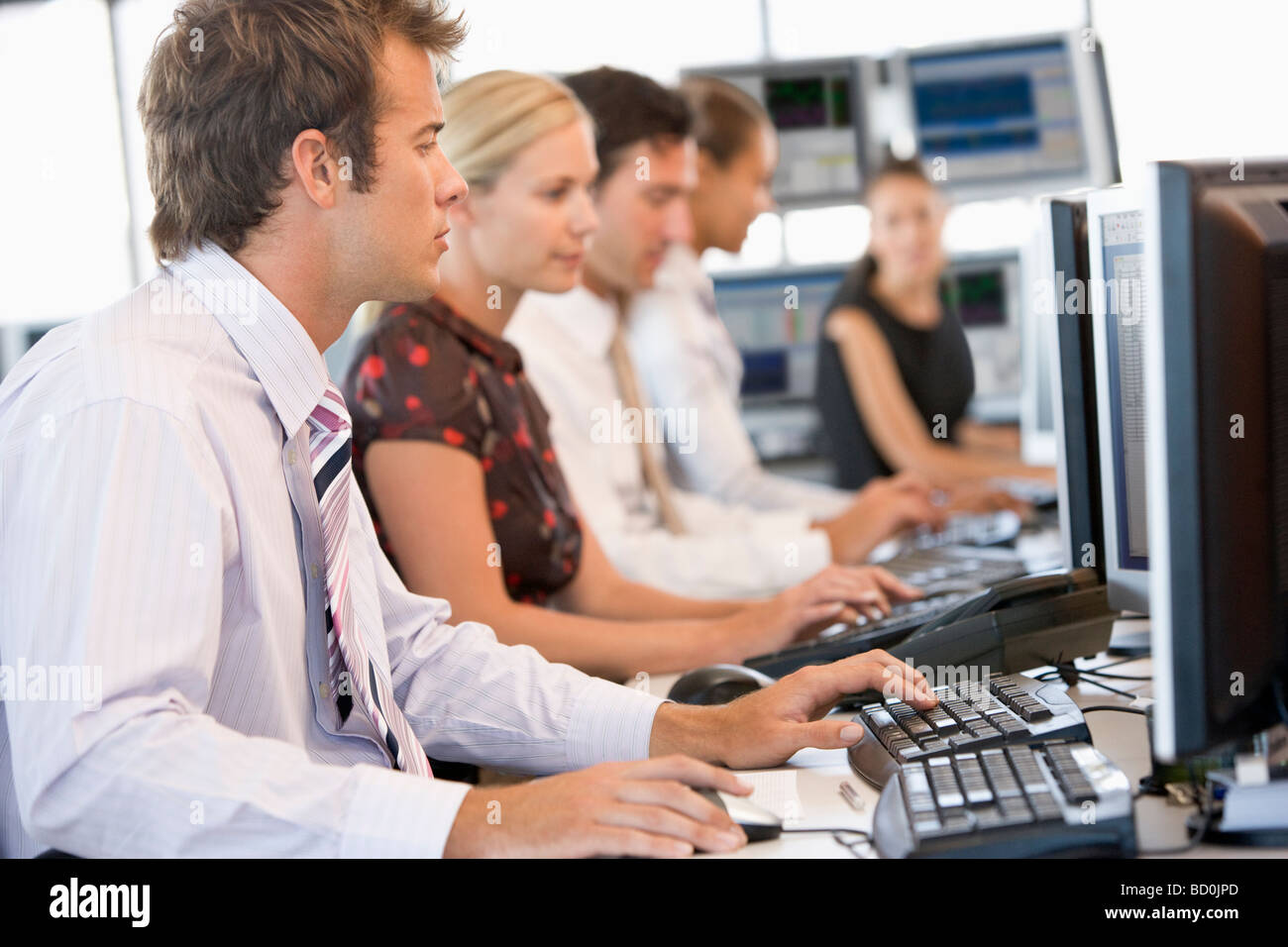 Stock Traders Working At Computers Stock Photo - Alamy