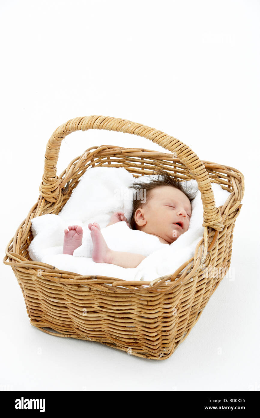 Newborn Baby Sleeping In Basket Stock Photo - Alamy