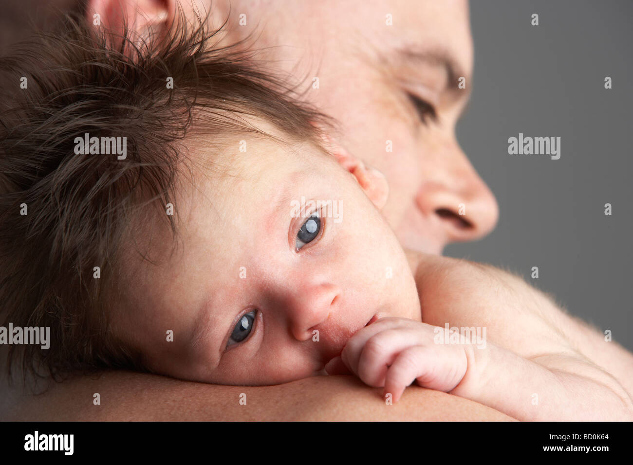 Father Hugging Newborn Baby Stock Photo