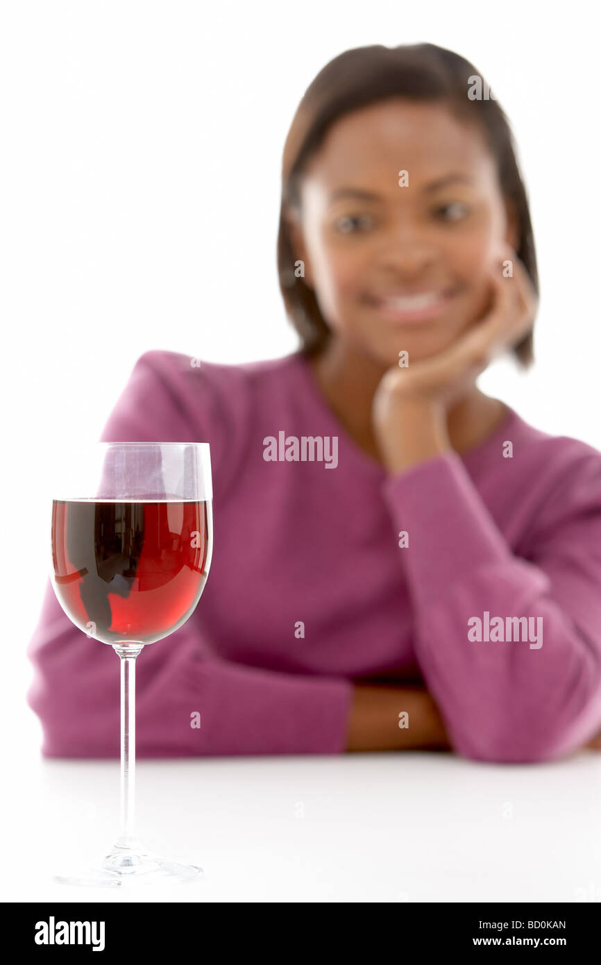 Woman Looking At Glass Of Wine Stock Photo - Alamy