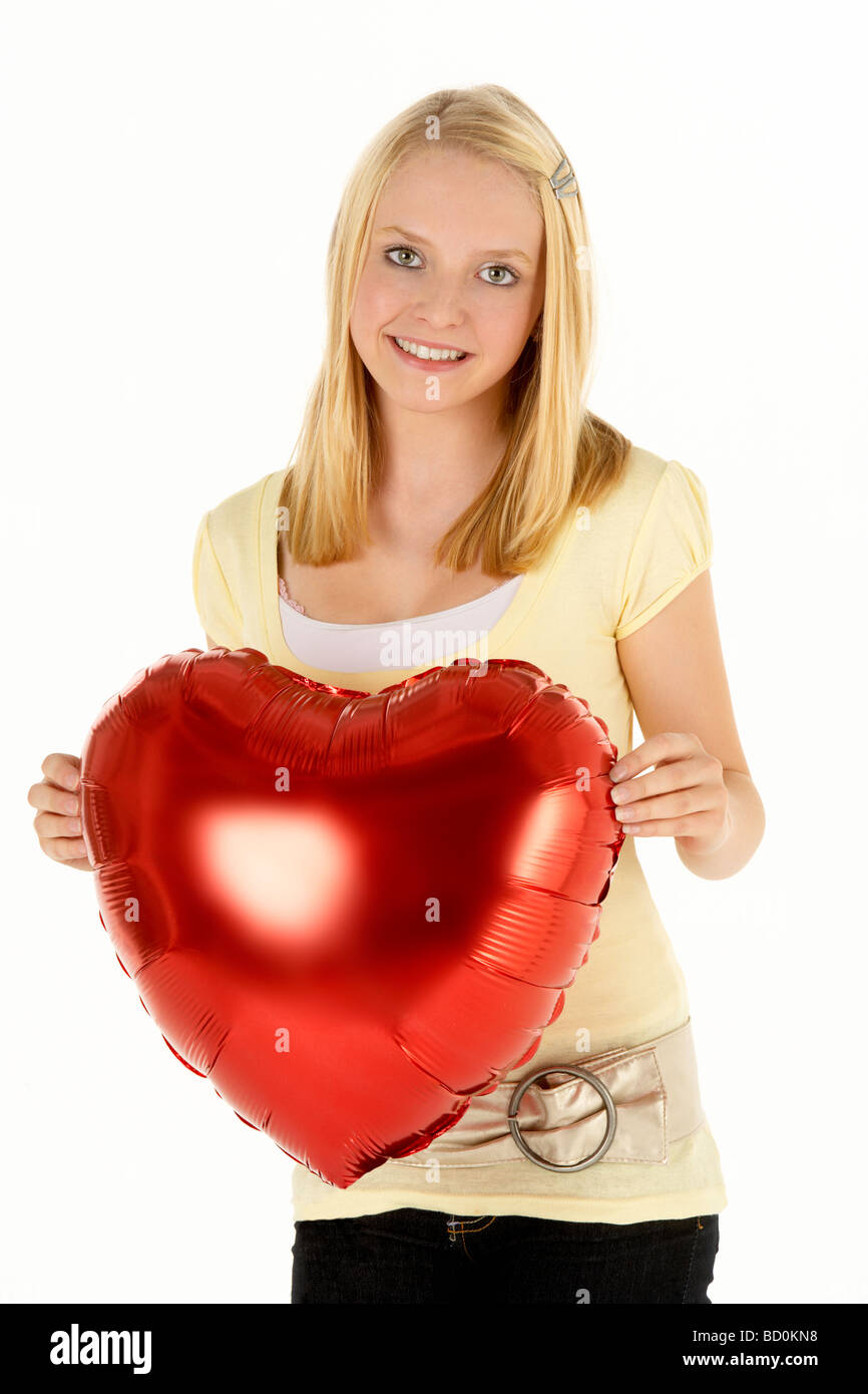 Girl holding heart shaped balloon hires stock photography and images