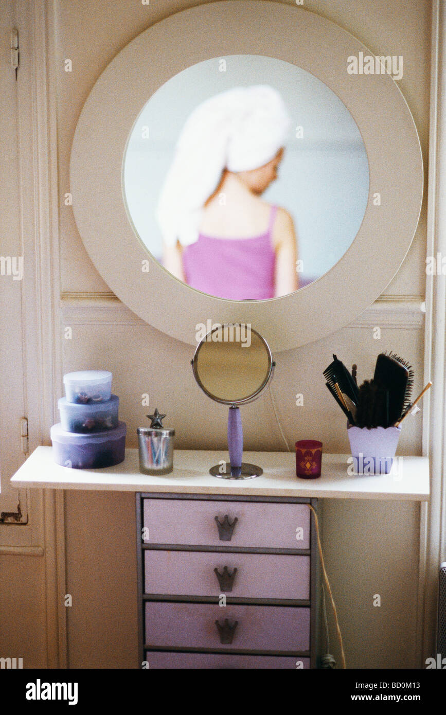 Reflection Of Woman With Head Wrapped In Towel In Mirror Hanging