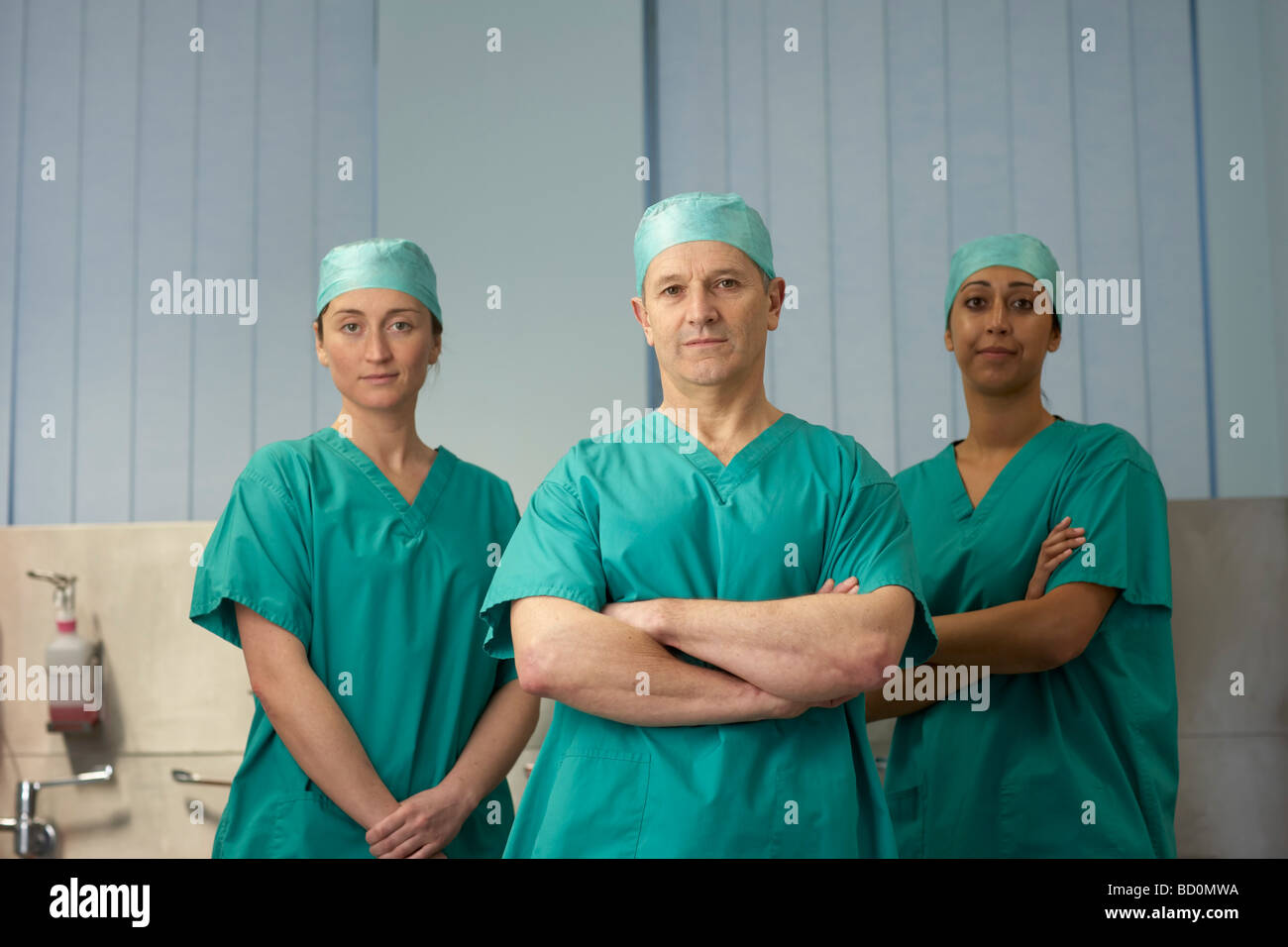 Three medical staff in scrubs Stock Photo Alamy