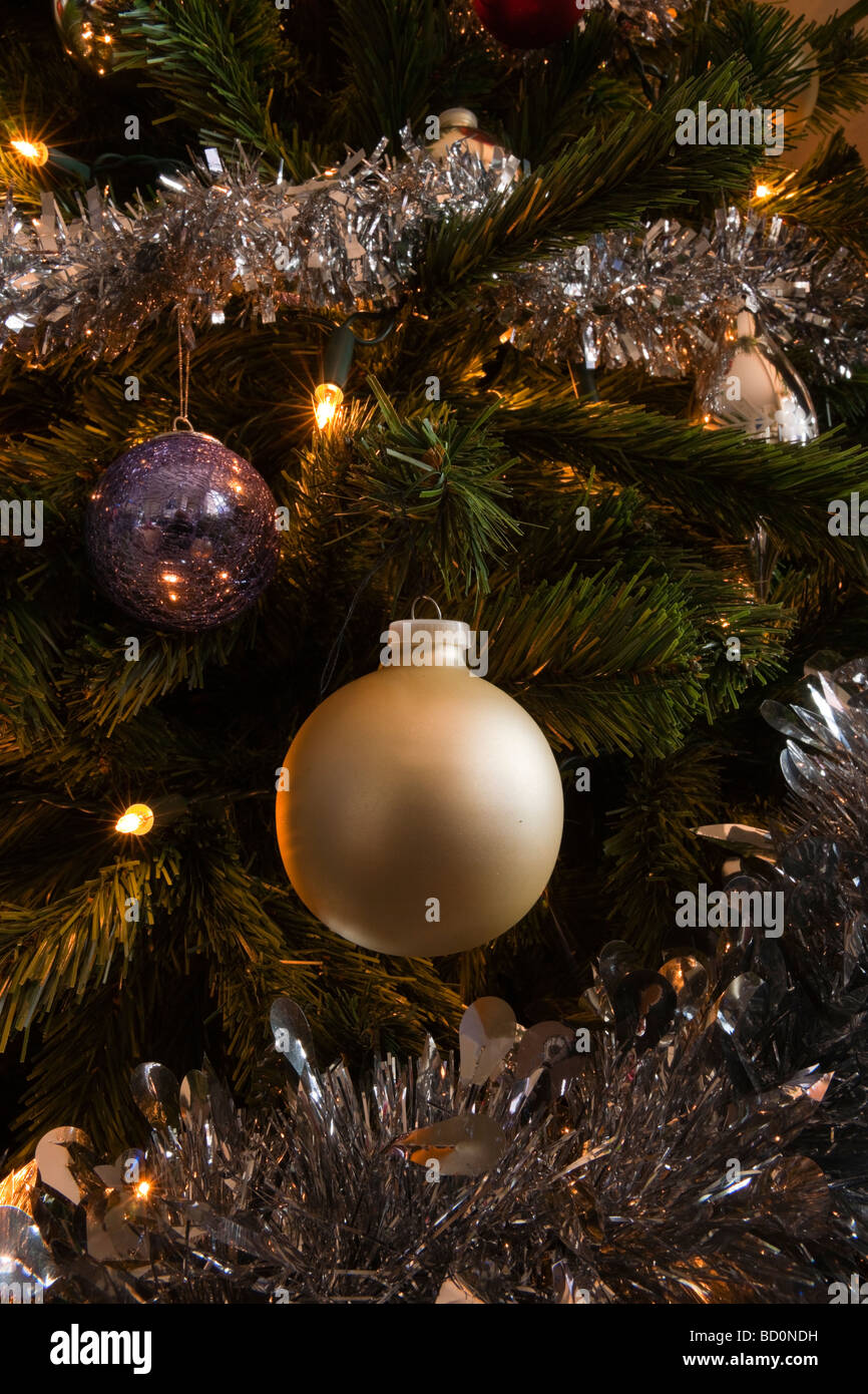 Detail of beige bauble and silver tensil on a christmas tree Stock Photo