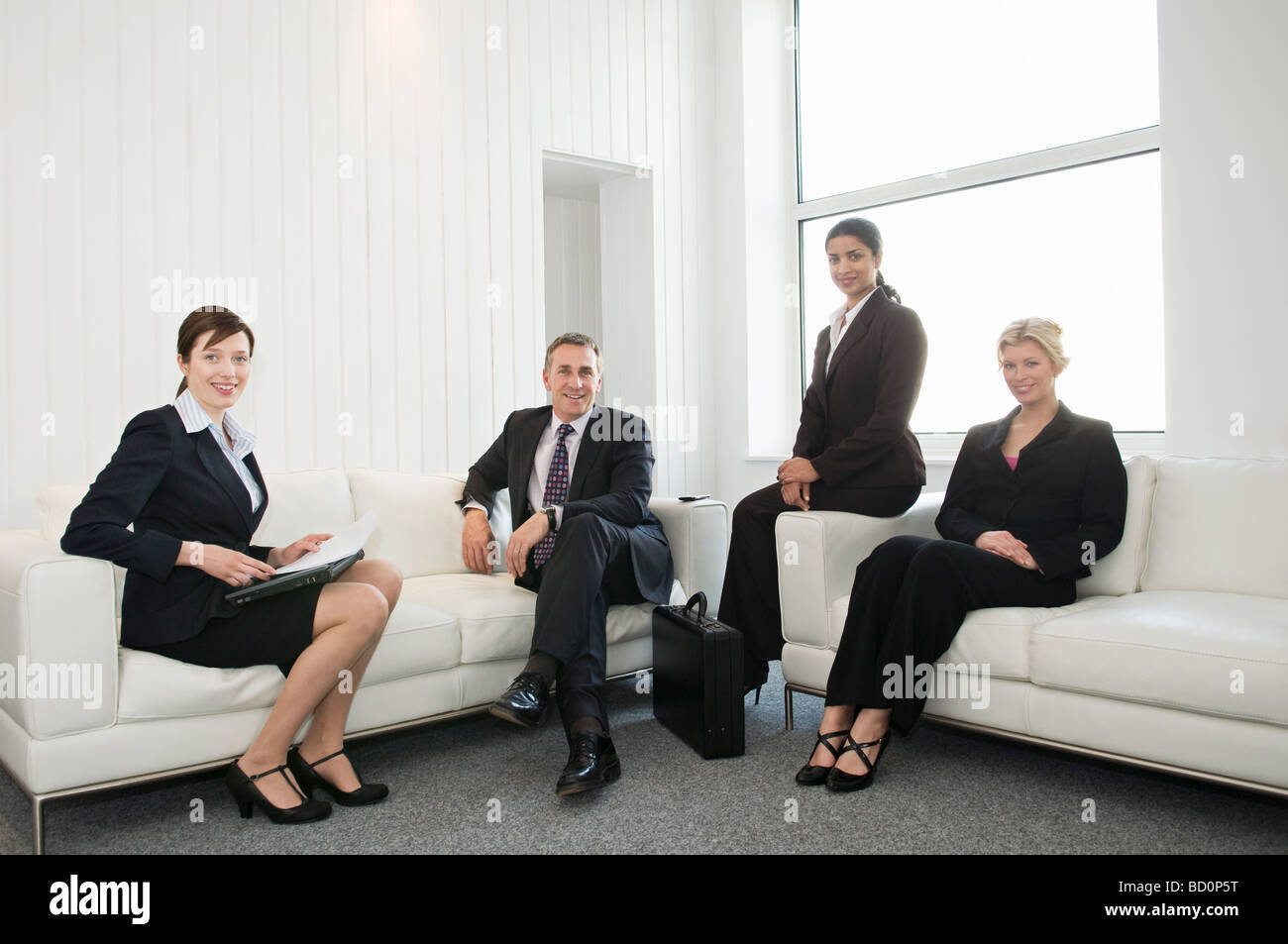 A portrait of four business people Stock Photo - Alamy