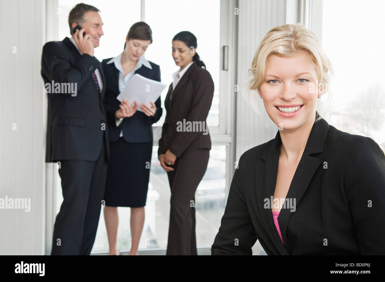 A portrait of a business woman smiling Stock Photo - Alamy