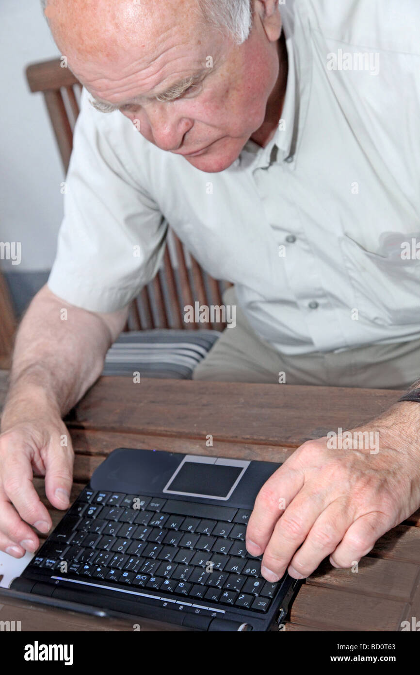 A senior with a Netbook Stock Photo