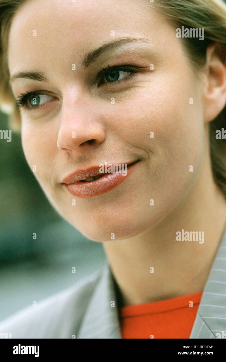 Woman smiling, looking away, portrait Stock Photo
