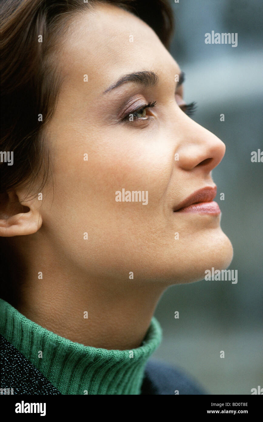 Woman looking away with eye on future aspirations Stock Photo