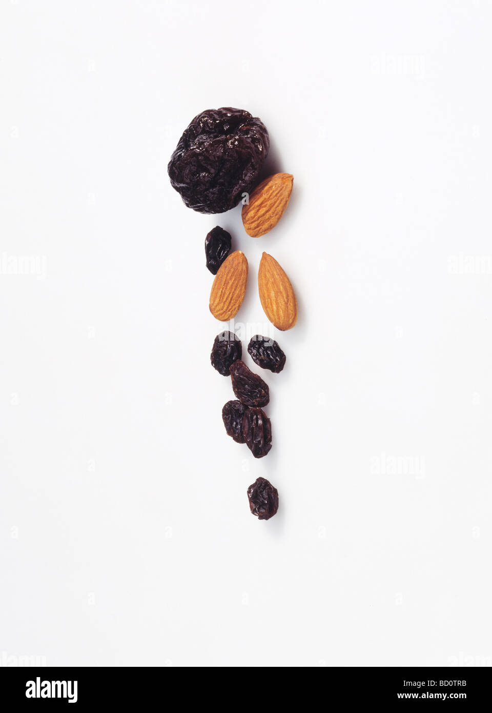 raisins and almonds against a white background Stock Photo Alamy