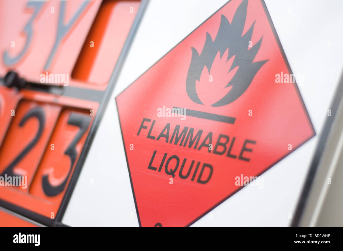Close up of a flammable liquid sign on the back of a tanker carrying dangerous liquid on the road Stock Photo