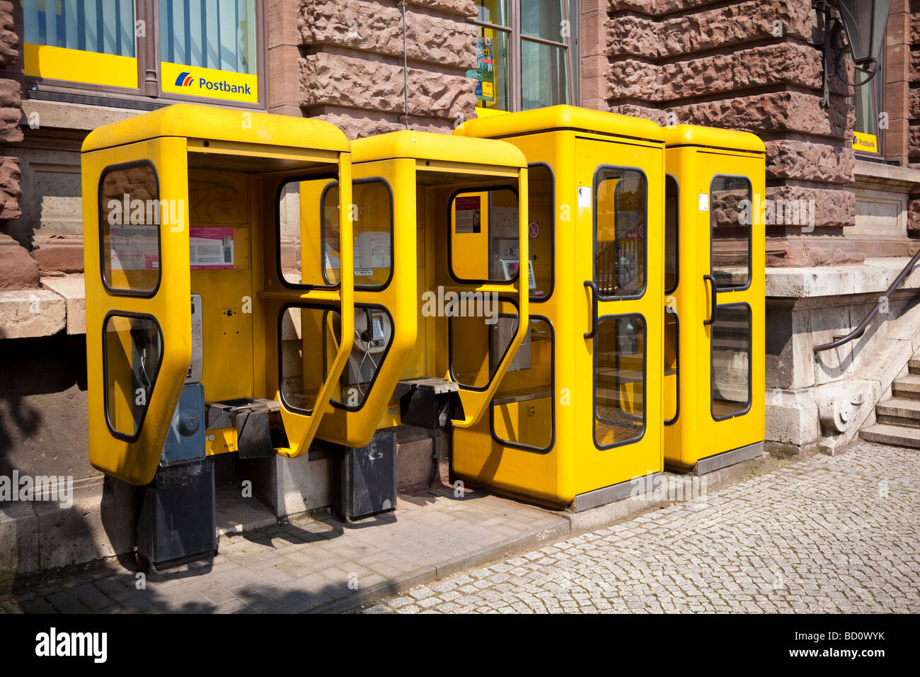 Row of German telephone kiosks boxes, phone box Germany, Europe Stock Photo
