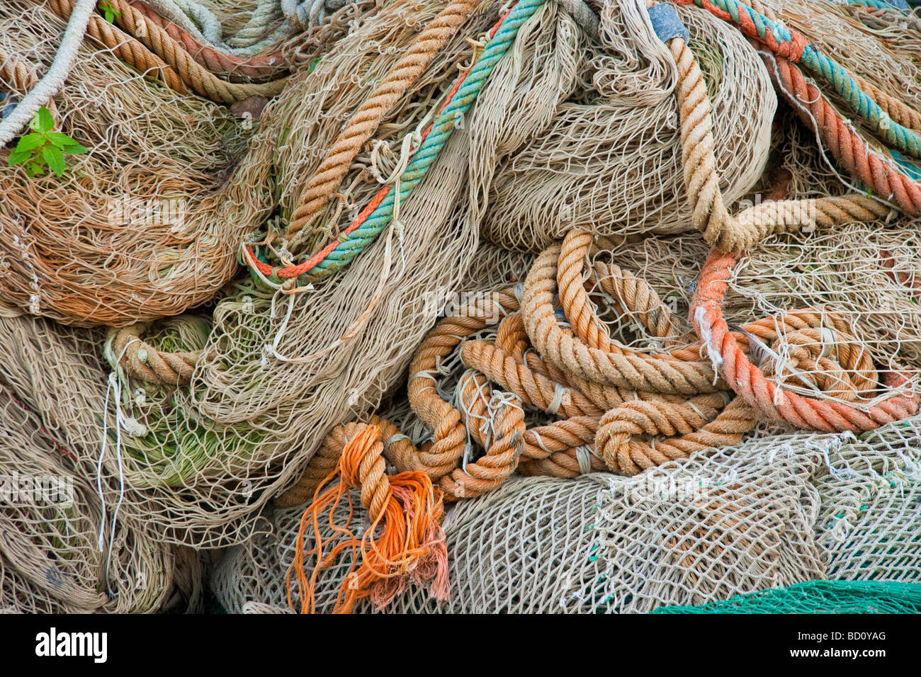 Stack of fishing nets in harbour or Porto Ercole in Tuscany Italy Stock Photo