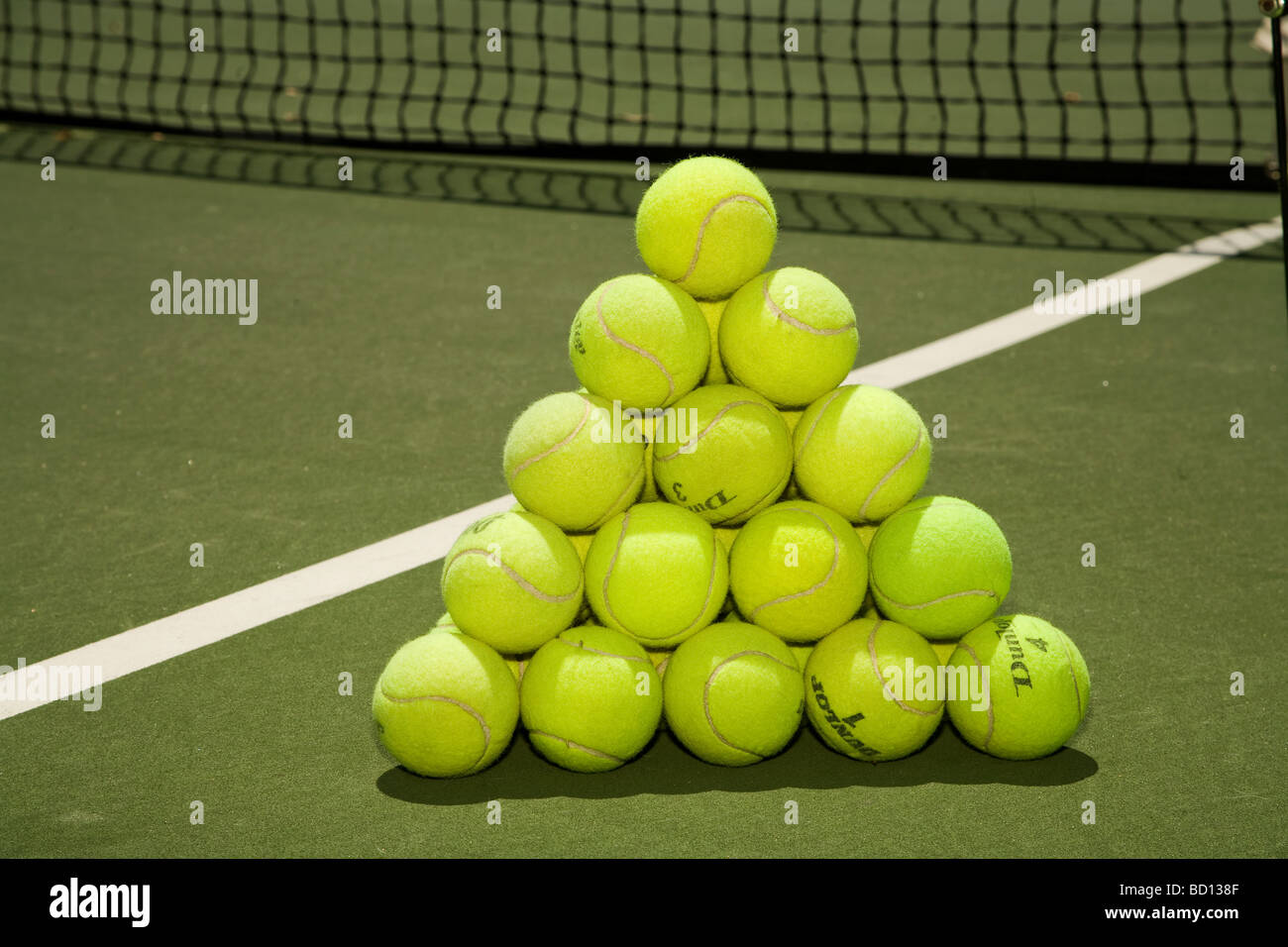 Tennis Balls stacked to form a regular tetrahedron. Stock Photo