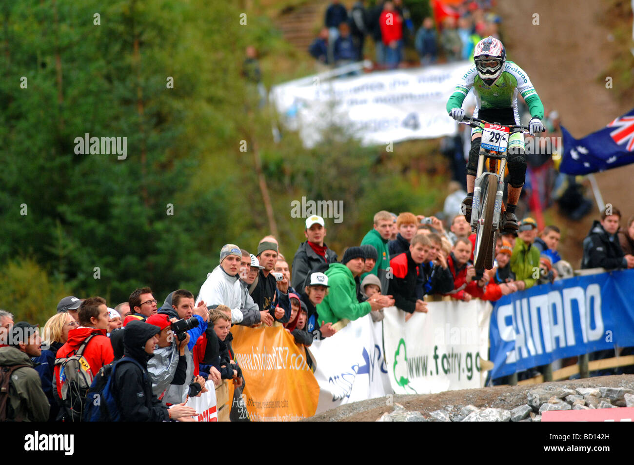 A downhill mountain biker jumps in to the finish arena at the Mountain Bike World Championships in Fort William, Scotland. Stock Photo