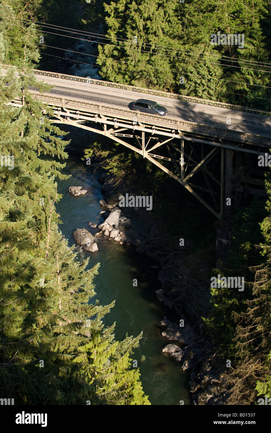 A car heads over the Granite Falls Bridge on the Mountain Loop Highway