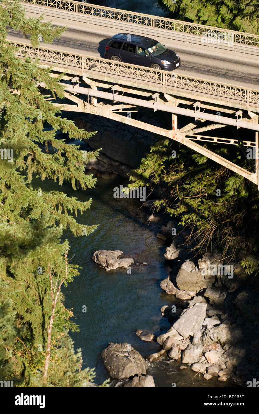 A car heads over the Granite Falls Bridge on the Mountain Loop Highway