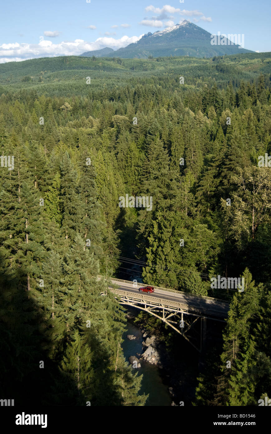 A car heads over the Granite Falls Bridge on the Mountain Loop Highway