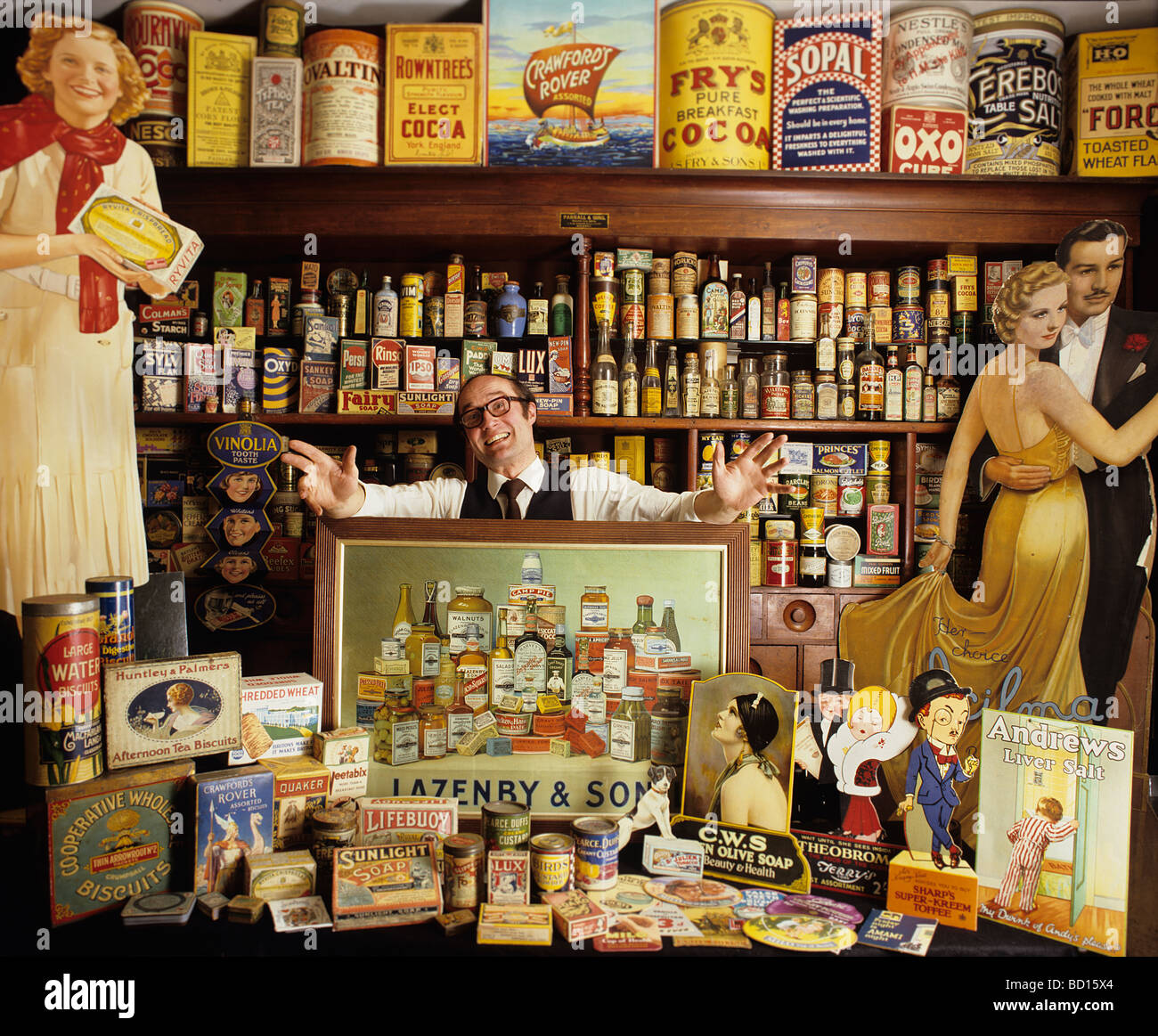 Robert Opie, collector of Advertising and Packaging, and museum curator (The Opie Collection), in his shop set-up. Stock Photo
