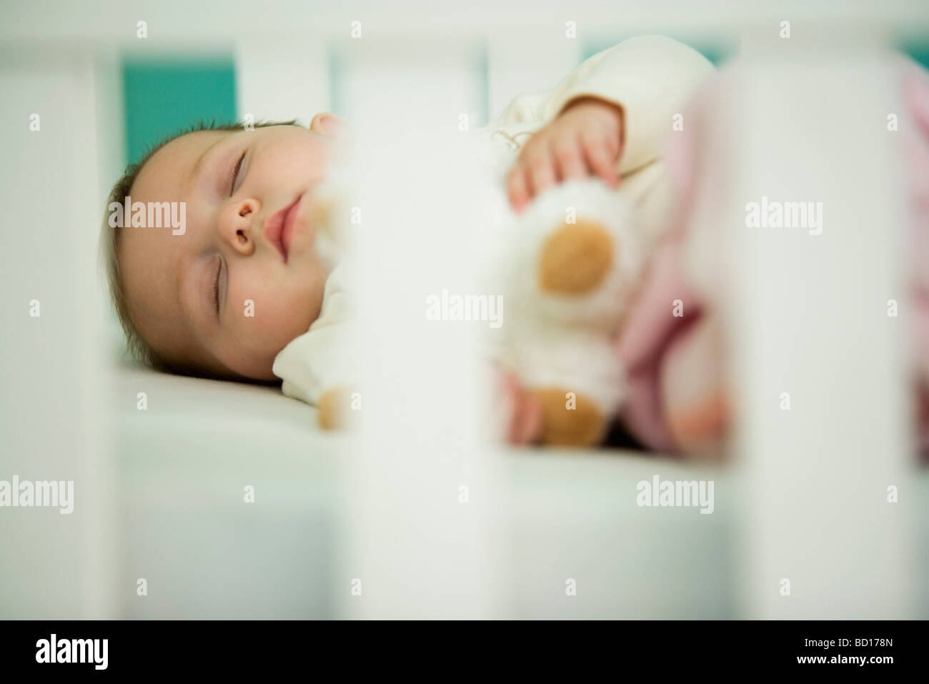 Baby Sleeping In Crib Stock Photo Alamy