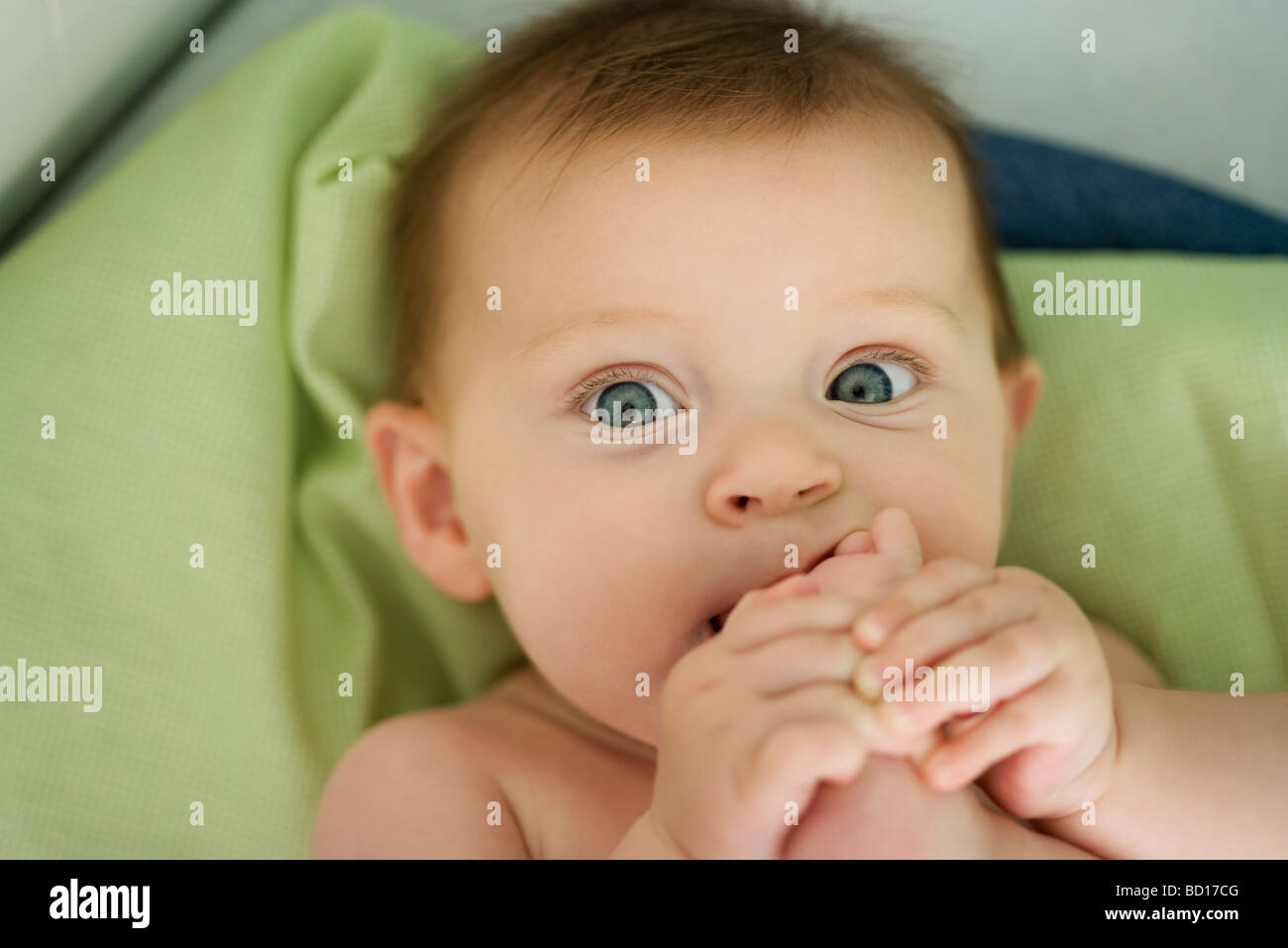 Baby with foot in mouth, close-up Stock Photo - Alamy